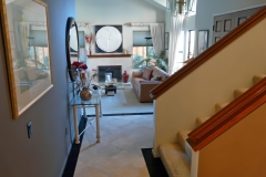 Entry, Stairs to Second Floor, and View to Living Room Fire Place