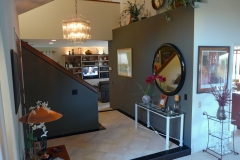 Entry with Beige Marble and Black Granite Floor